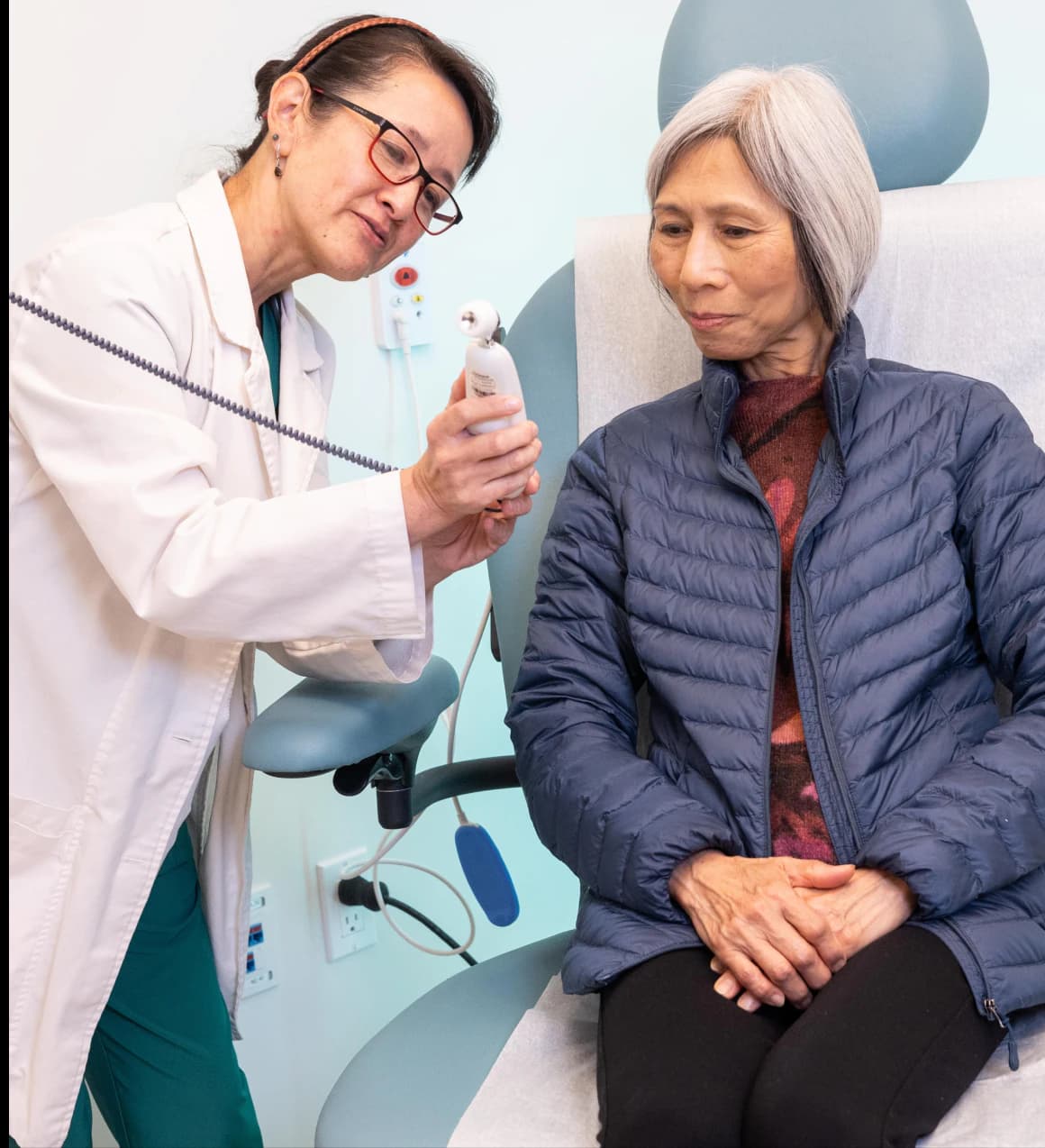 Healthcare worker assisting senior patient