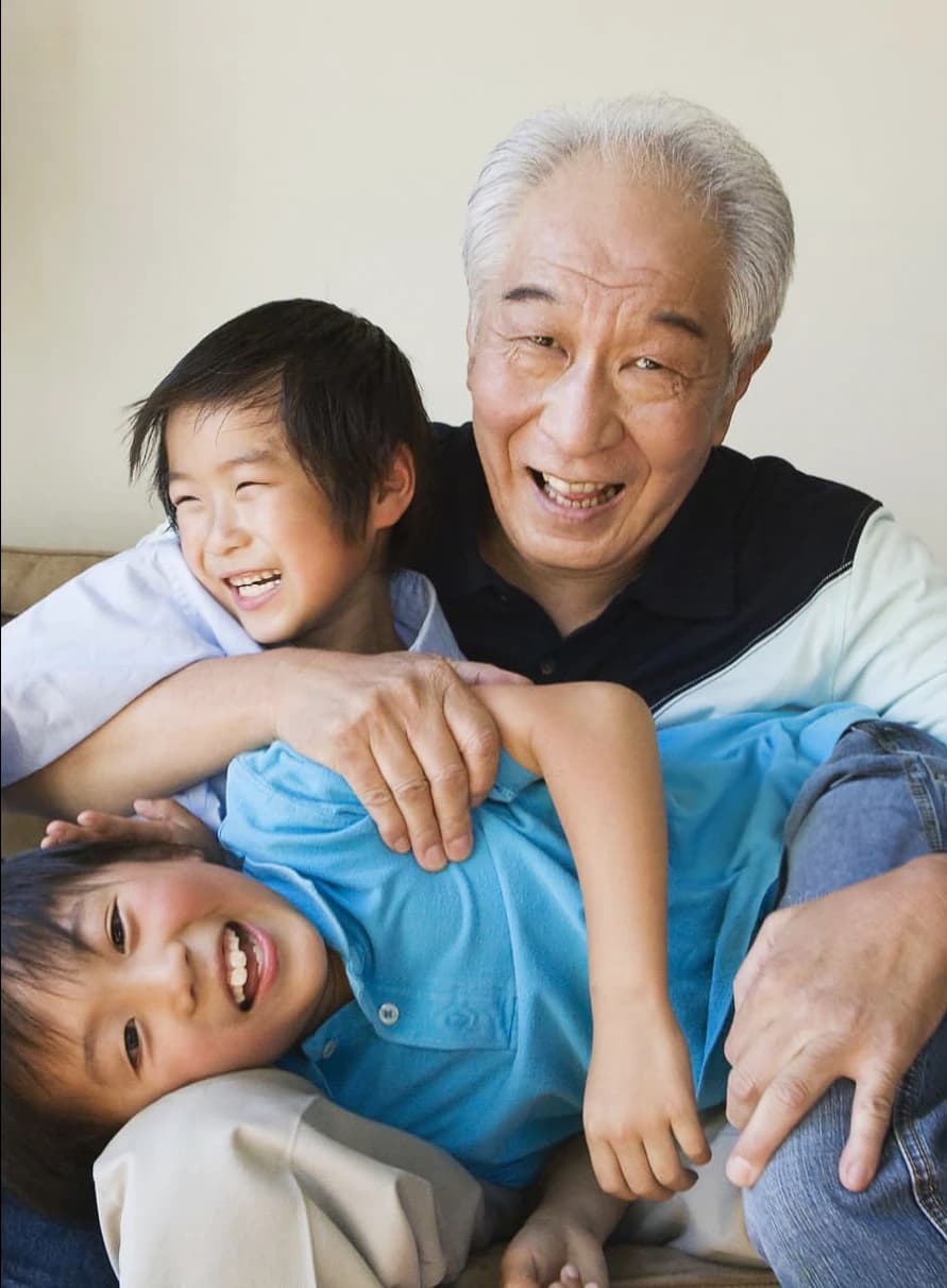 Grandfather playing with grandchildren